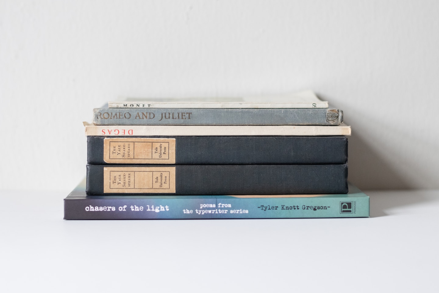 A stack of books sitting on top of each other