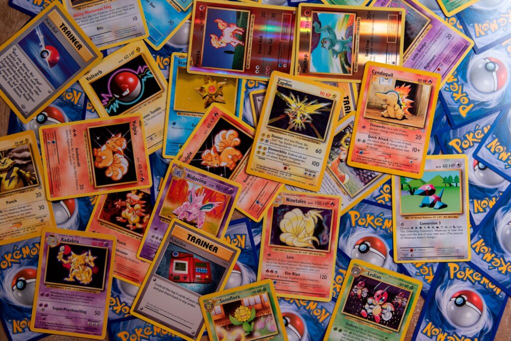 A bunch of Pokémon Trading Cards with Zapdos, Ninetales, Porygon, Cyndaquil, Ponyta, Machop, Vulpix and many more.